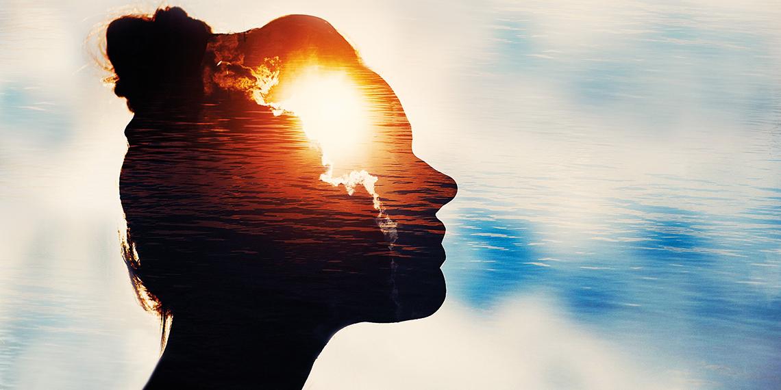 a woman at sunset