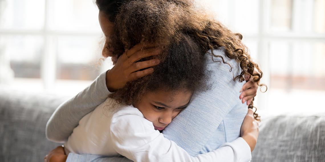 a woman hugging a child