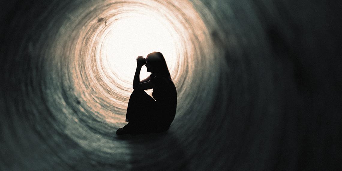 a woman in a tunnel