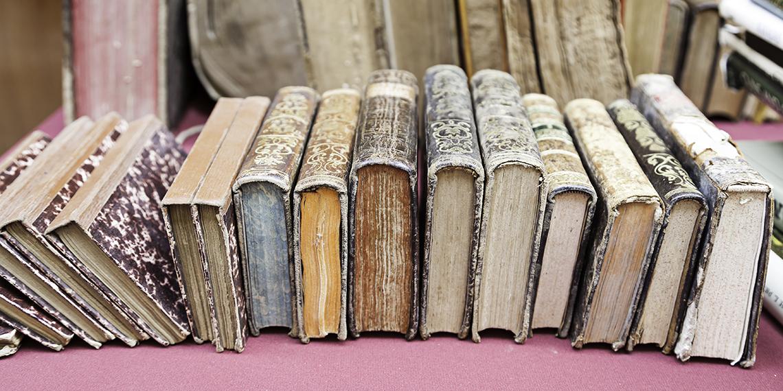 a stack of old bibles