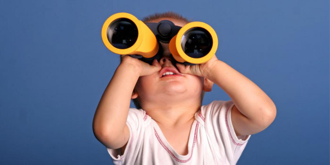 A boy with binoculars