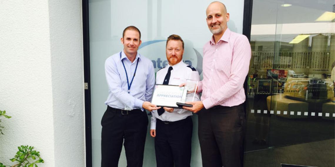Fonterra Environmental Manager Nic Bishop celebrates the five year partnership award with The Salvation Army's Shane Chisholm and Fonterra Brands New Zealand Managing Director Leon Clement
