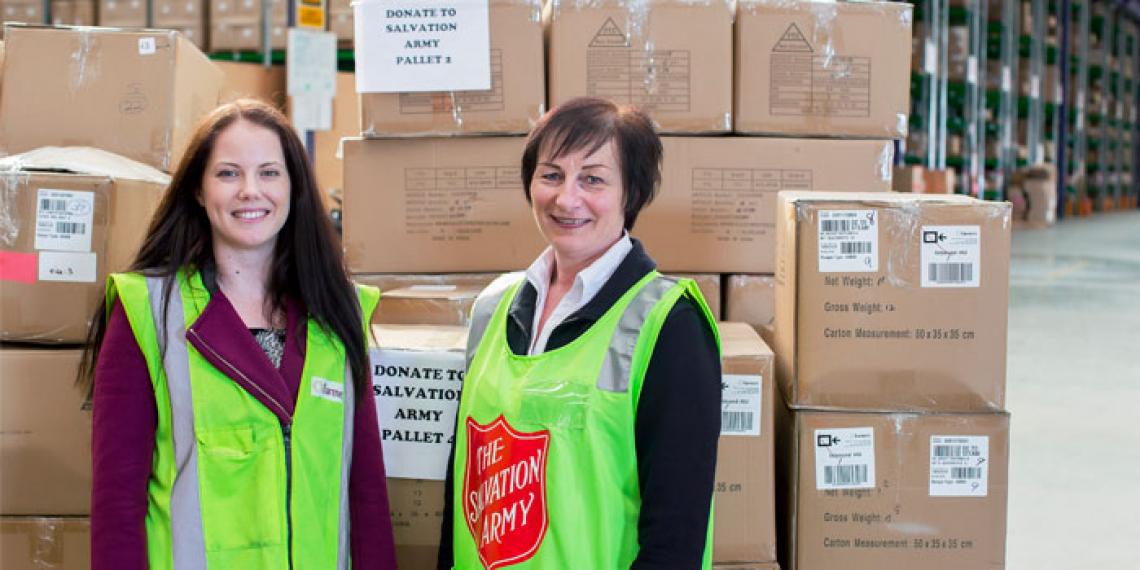 (L-R) Jordan Goodall of Farmers joins Raewyn Butler from The Salvation Army with some of their recent clothing donations.