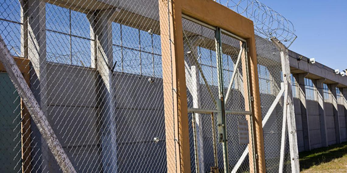 a prison gate and fence