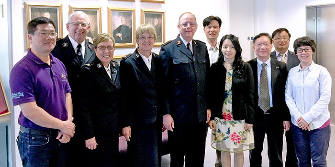 The photograph shows (from left) Mr Guang-ling Que (Section Chief of the Ethnic and Religious Affairs Bureau of Guangzhou), the Chief of the Staff, Commissioner Rosalie Peddle (World Secretary for Women's Ministries), Commissioner Silvia Cox (World President of Women's Ministries), the General, the Rev Sui-sheng Chen (Administrative Vice President of Guangzhou Christian Council), Miss Dan Chen, the Rev Hao Feng, the Rev Bing-sheng Lin (Vice President of Guangzhou Christian Council) and Mrs Xiao-xing Feng-D