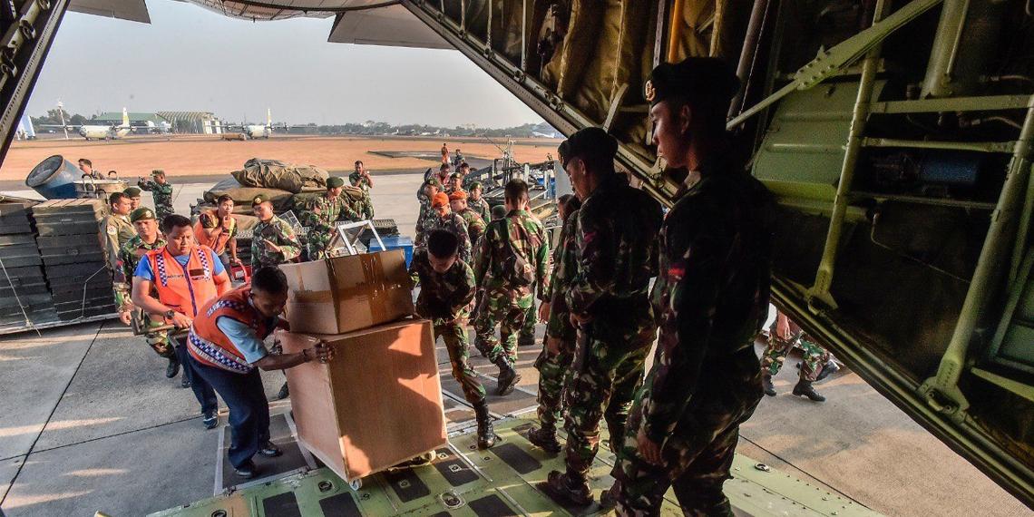 quake relief supplies being loaded onto Indonesian Air force plane