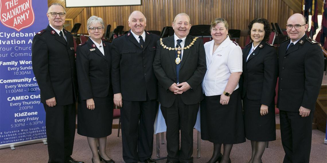 Majors Richard and Ann Borrett. Major Dean Logan, Provost William Hendrie, Major Allison Logan, and Commissioners Lyndon and Bronwyn Buckingham