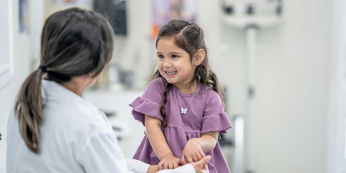 A female clinician with a child