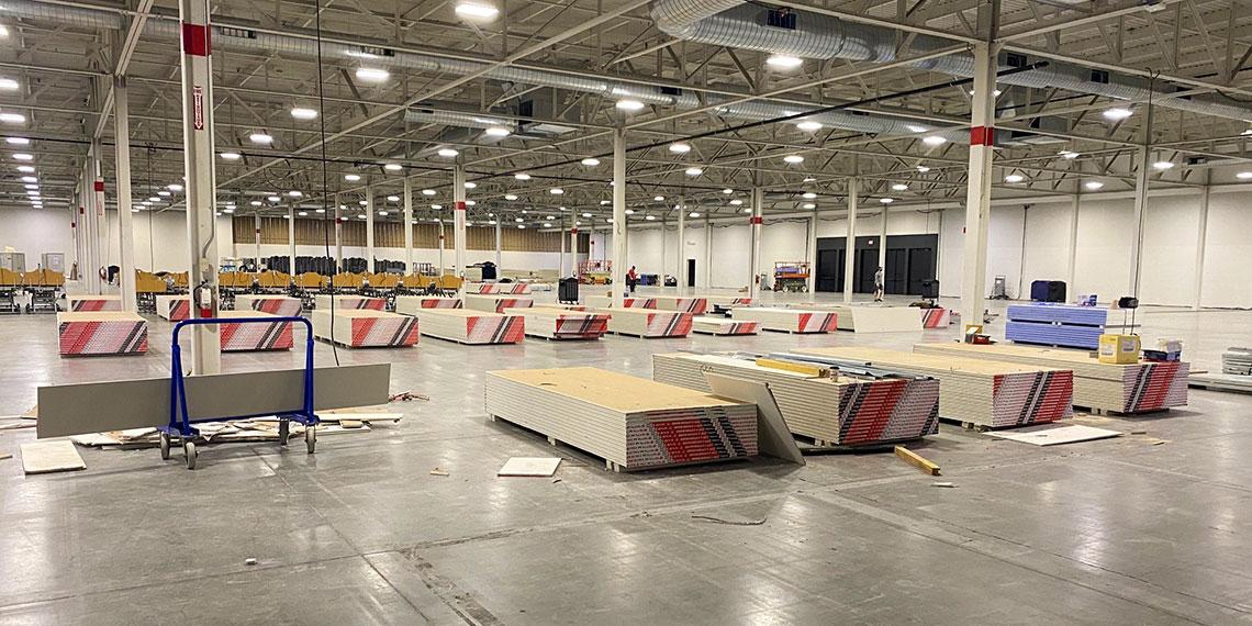 Temporary Salvation Army COVID-19 care facility being assembled at Toronto Congress Centre