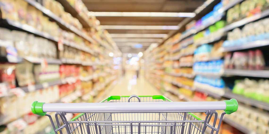 Supermarket trolley in aisle