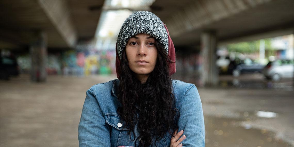Rough living woman looking at camera