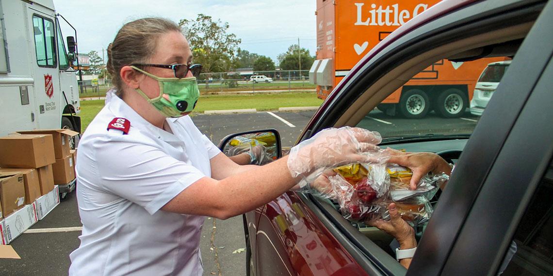 TSA Officer giving out food in response to Hurricane Sally