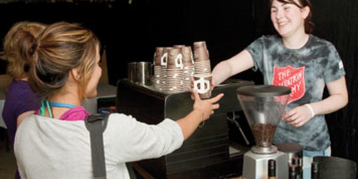 Salvation Army youth serving fair trade coffee; photo by Luke Tearle